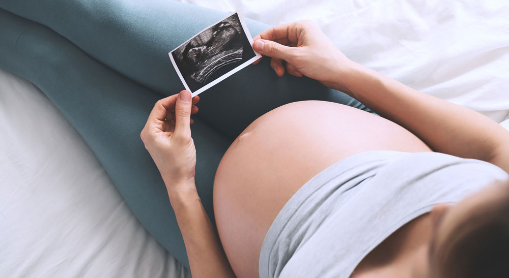 THSMC holding a pregnancy scan